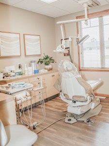 Clean, modern dental treatment room with natural light